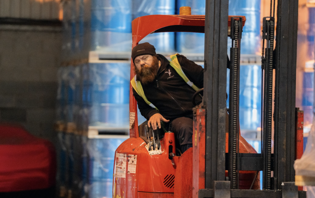 Jenkar warehouse worker driving a forklift truck